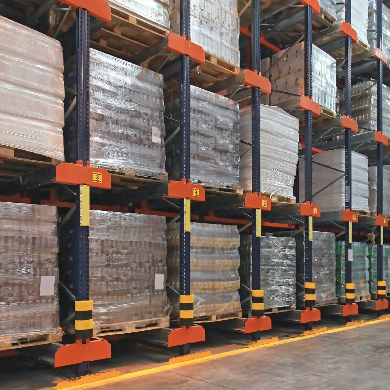 glass bottles stacked on each other in the warehouse